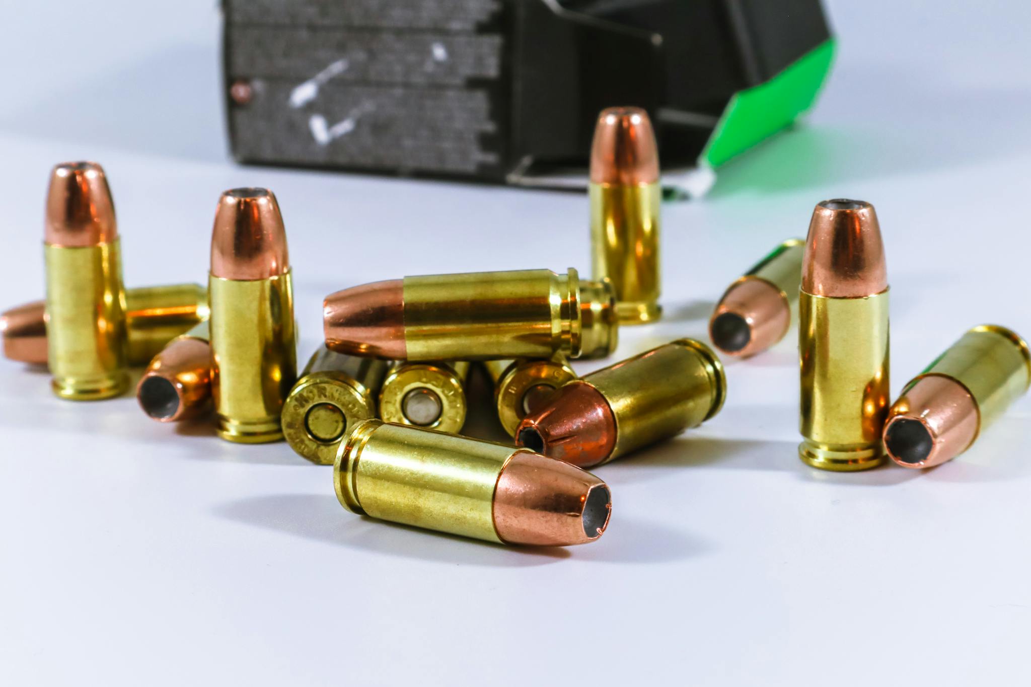 A detailed close-up of copper-colored bullets arranged on a surface, perfect for illustrating military or security themes.